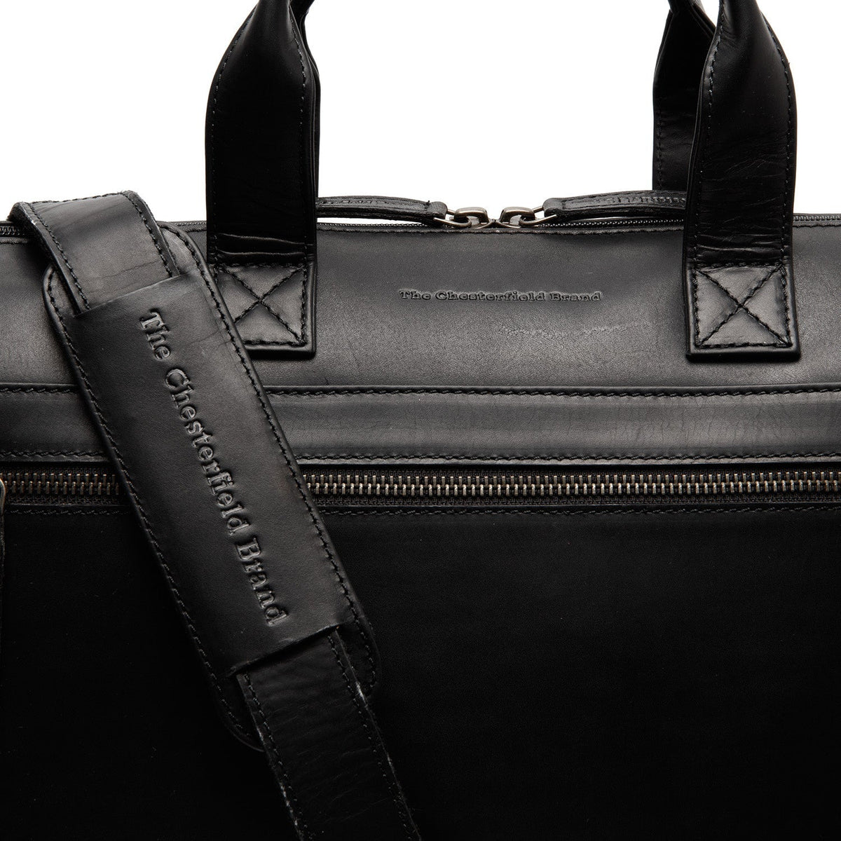 
Solid Antique Brass Hardware & Heavy-Duty Dual Zipper Detail on Levanto Full-Grain Leather Laptop Bag