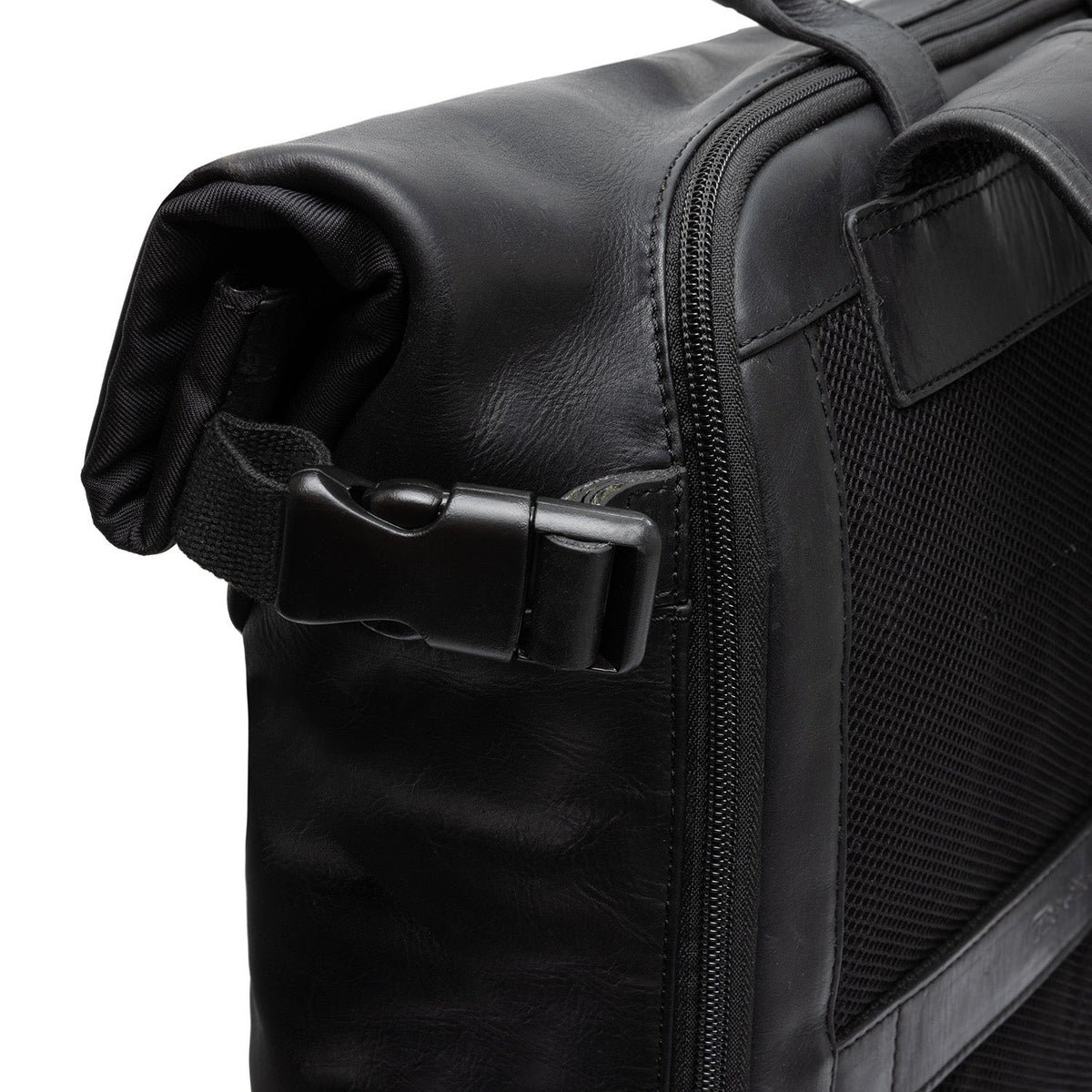 
Solid Antique Brass Hardware & Heavy-Duty Dual Zipper Detail on Bornholm Full-Grain Leather Roll-top Backpack